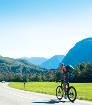 bicyclist riding in the mountain side